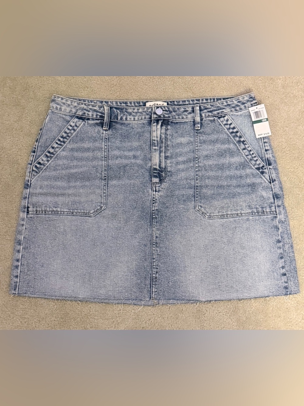 Edited faded light blue denim mini skirt